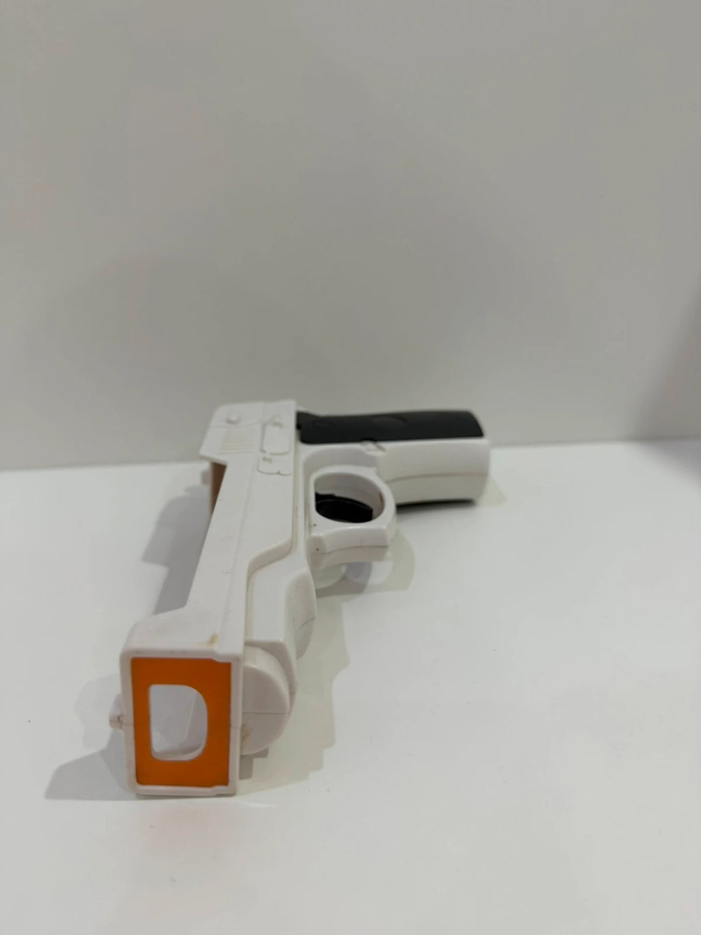 Value white hat with Nintendo Wii logo and gun controller design.