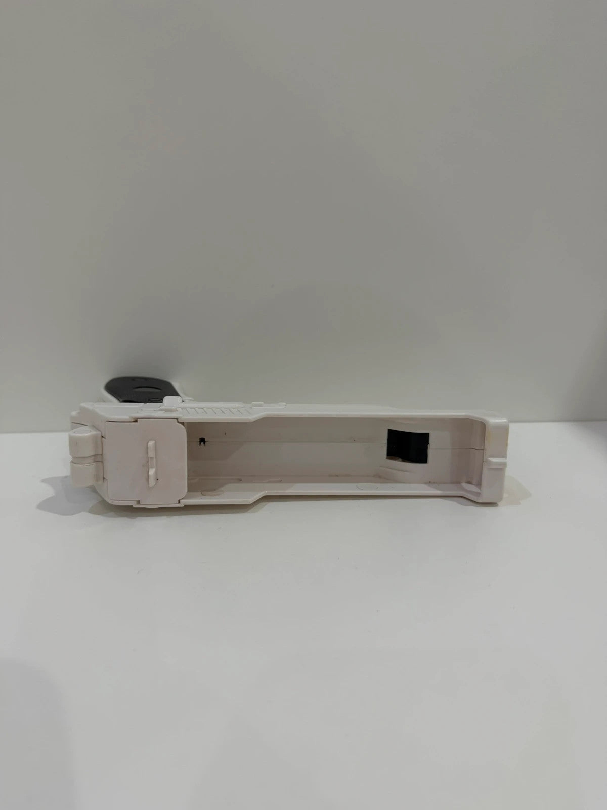 Value white hat with Nintendo Wii logo and gun controller design.