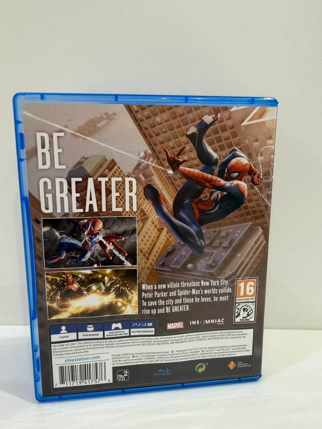 Marvel’s Spider-Man PS4 game case with disc, manual, and vibrant cover art.
