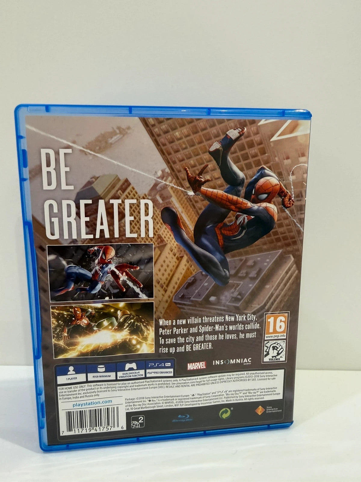 Marvel’s Spider-Man PS4 game case with disc, manual, and vibrant cover art.