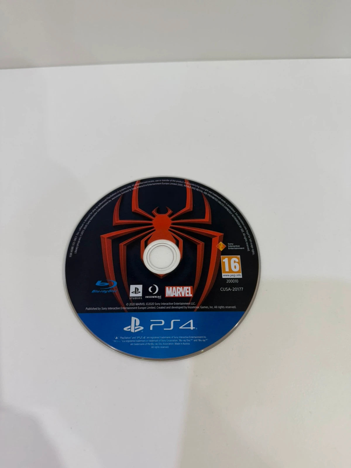 Marvel Spider-Man Miles Morales PS4 game disc with case and cover art.