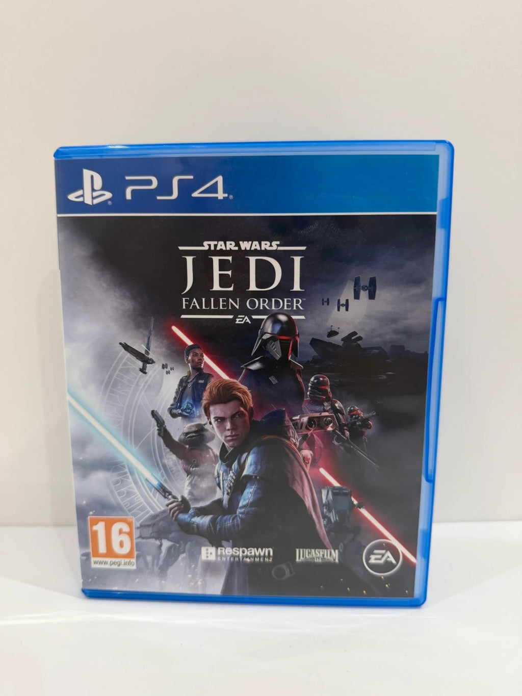 Star Wars Jedi Fallen Order PS4 game disc and case with vibrant cover art.