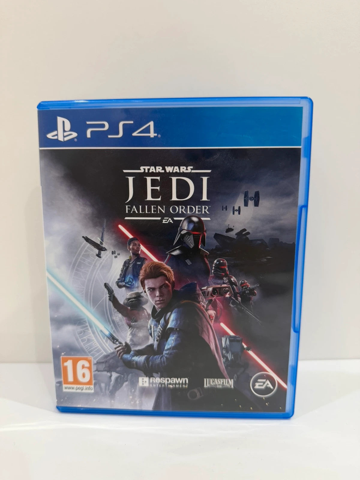 Star Wars Jedi Fallen Order PS4 game disc and case with vibrant cover art.