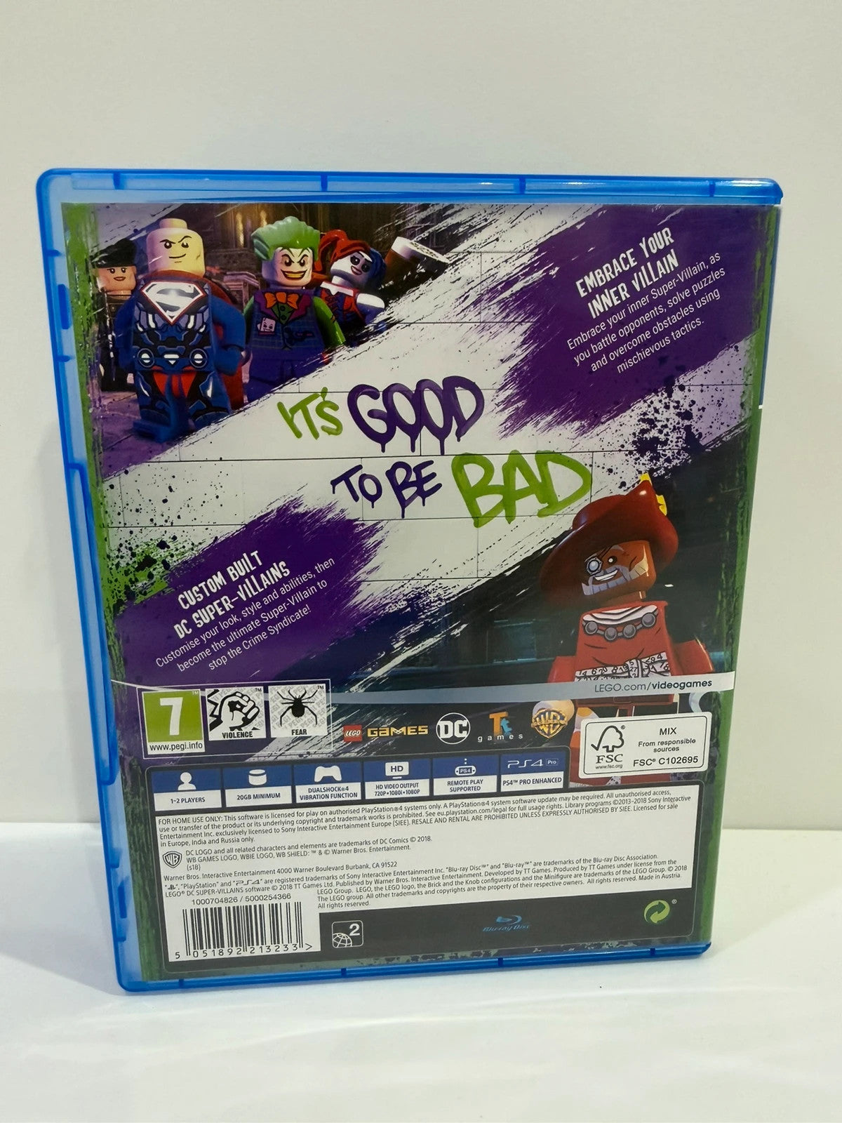 LEGO DC Super Villains PS4 game disc and case with colorful superhero graphics.