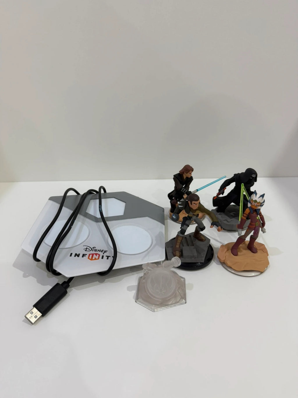Disney Infinity 3.0 video game bundle for PS4 with game disc, base, and character figures.