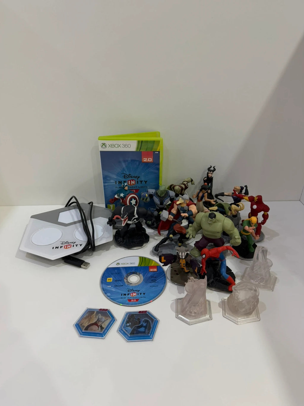 Disney Infinity 2.0 video game bundle for Xbox 360 with character figures and base.