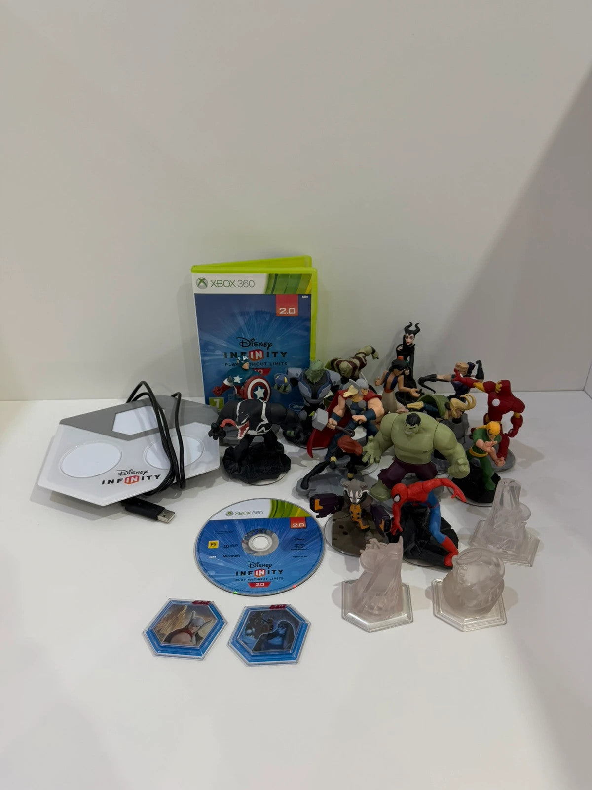 Disney Infinity 2.0 video game bundle for Xbox 360 with character figures and base.