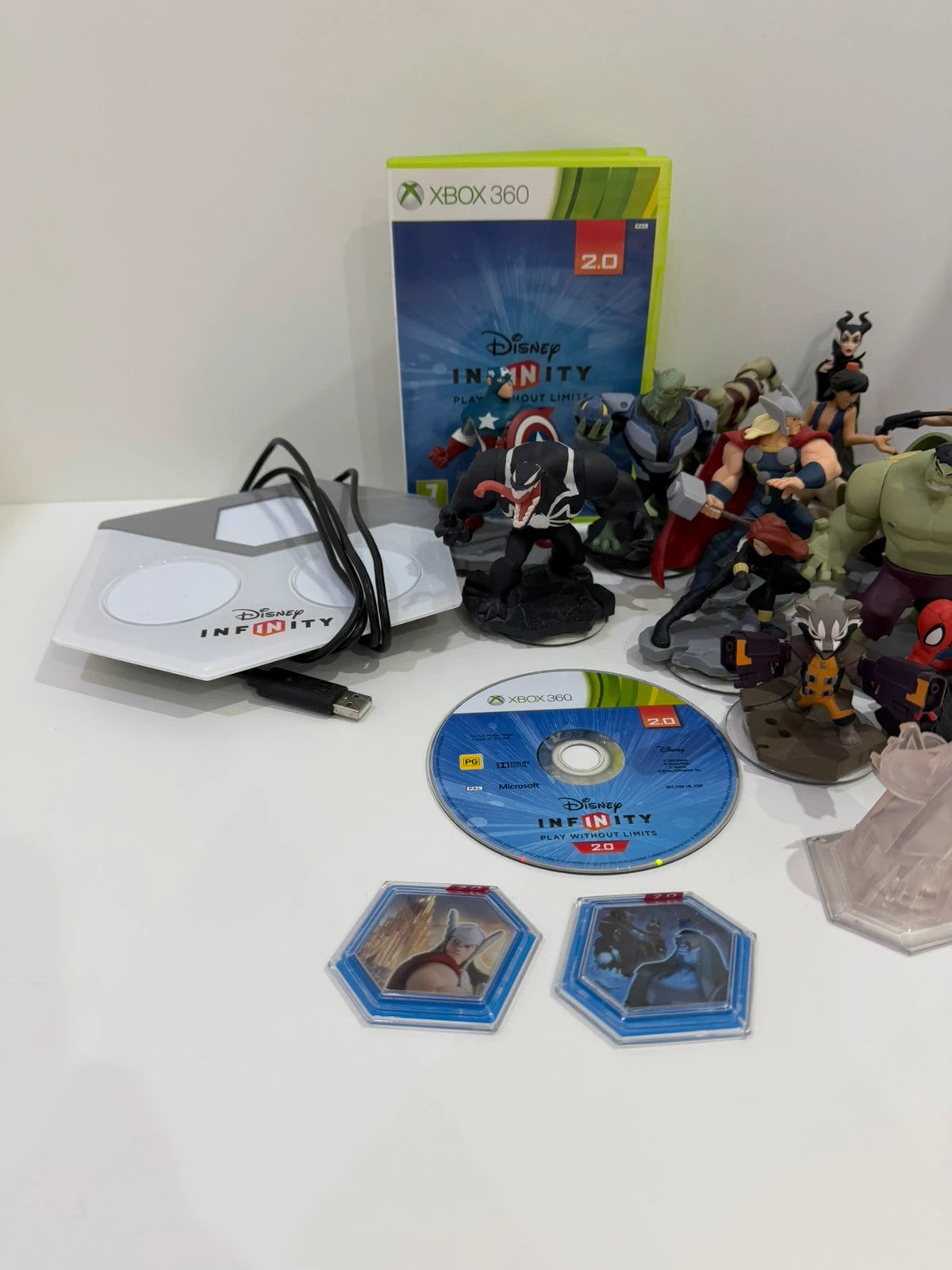 Disney Infinity 2.0 video game bundle for Xbox 360 with character figures and base.