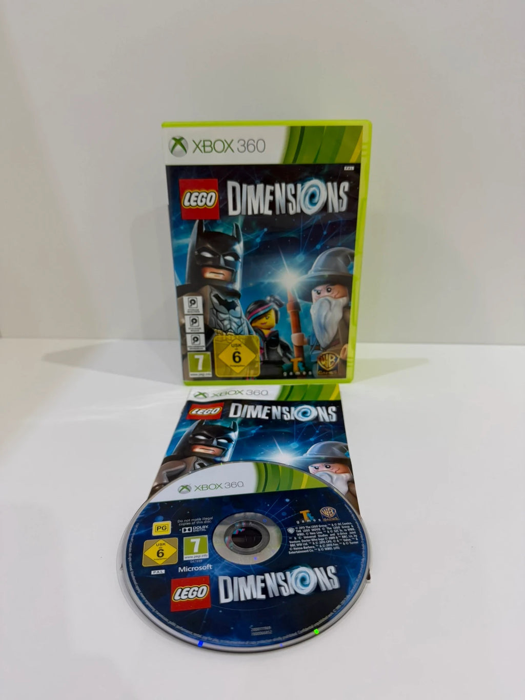 LEGO Dimensions video game bundle for Xbox 360 with USB Toy Pad and character figures.