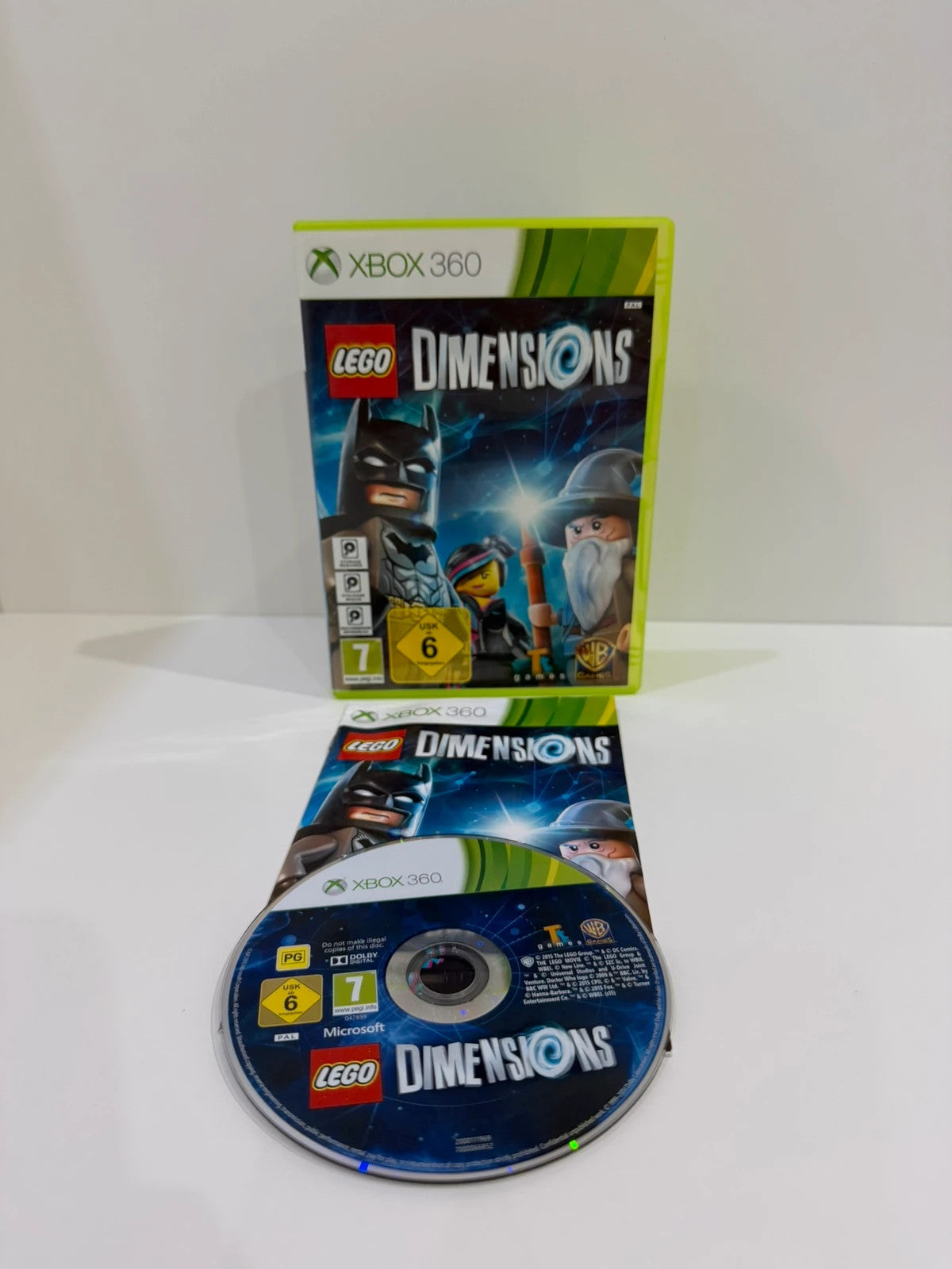 LEGO Dimensions video game bundle for Xbox 360 with USB Toy Pad and character figures.