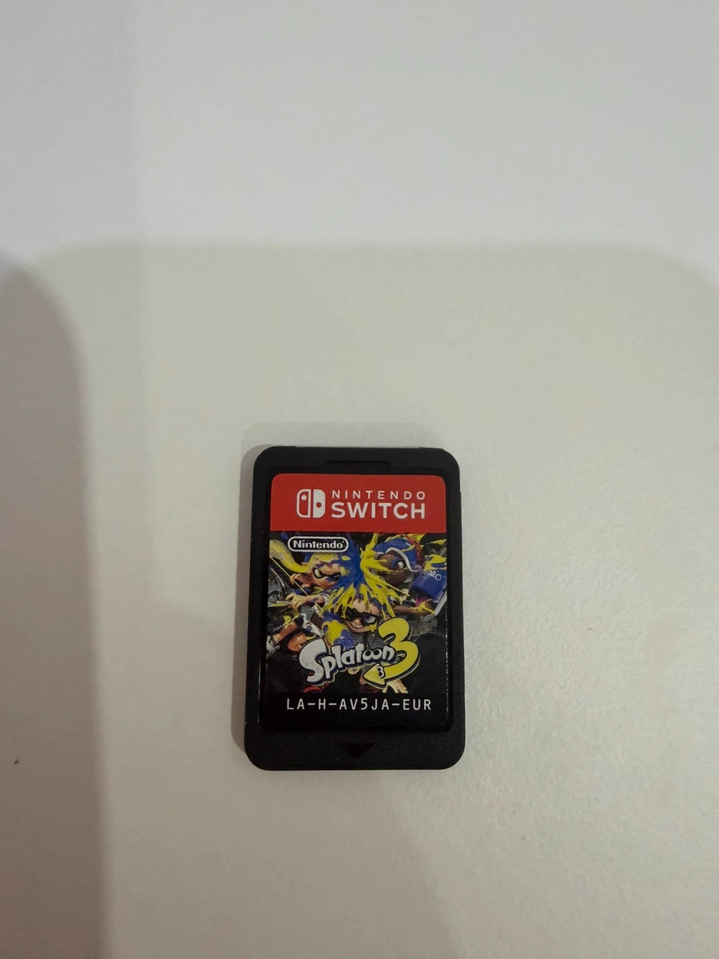 Splatoon 3 Nintendo Switch game cartridge with colorful cover art and case.