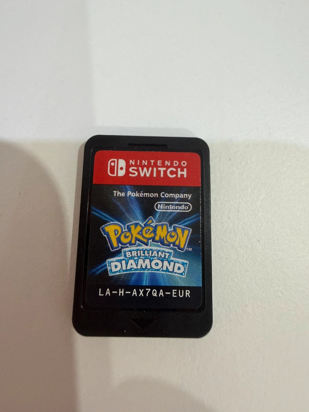 Pokémon Brilliant Diamond Nintendo Switch game cartridge with vibrant artwork and logo.
