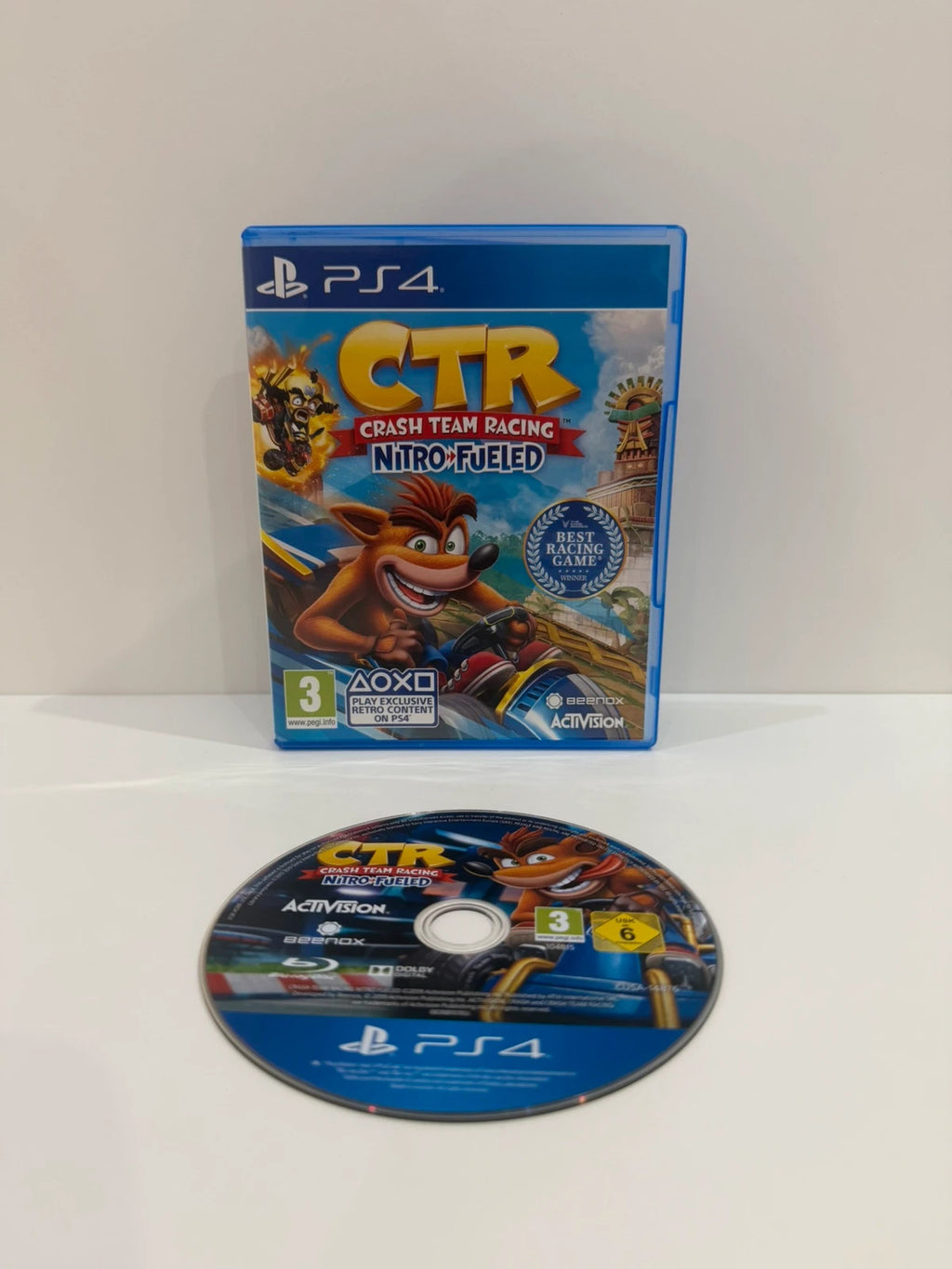 Crash Team Racing Nitro-Fueled PS4 game disc and case with colorful cover art.