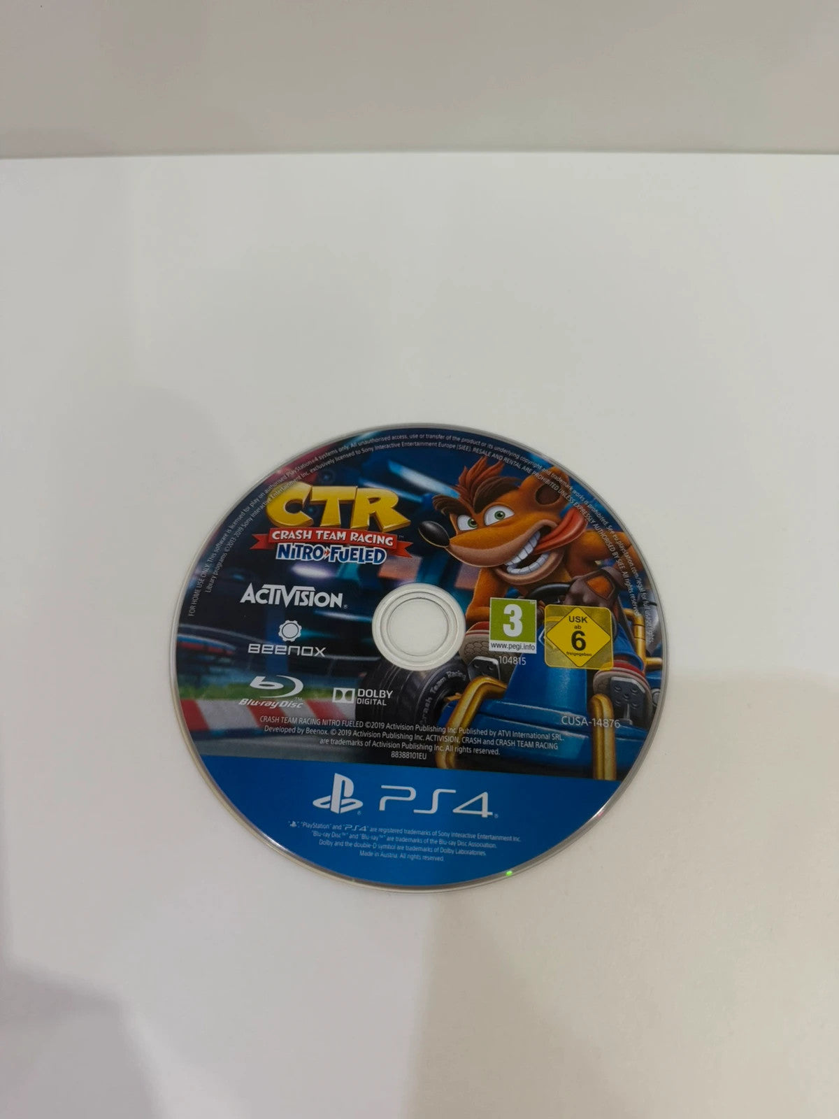 Crash Team Racing Nitro-Fueled PS4 game disc and case with colorful cover art.