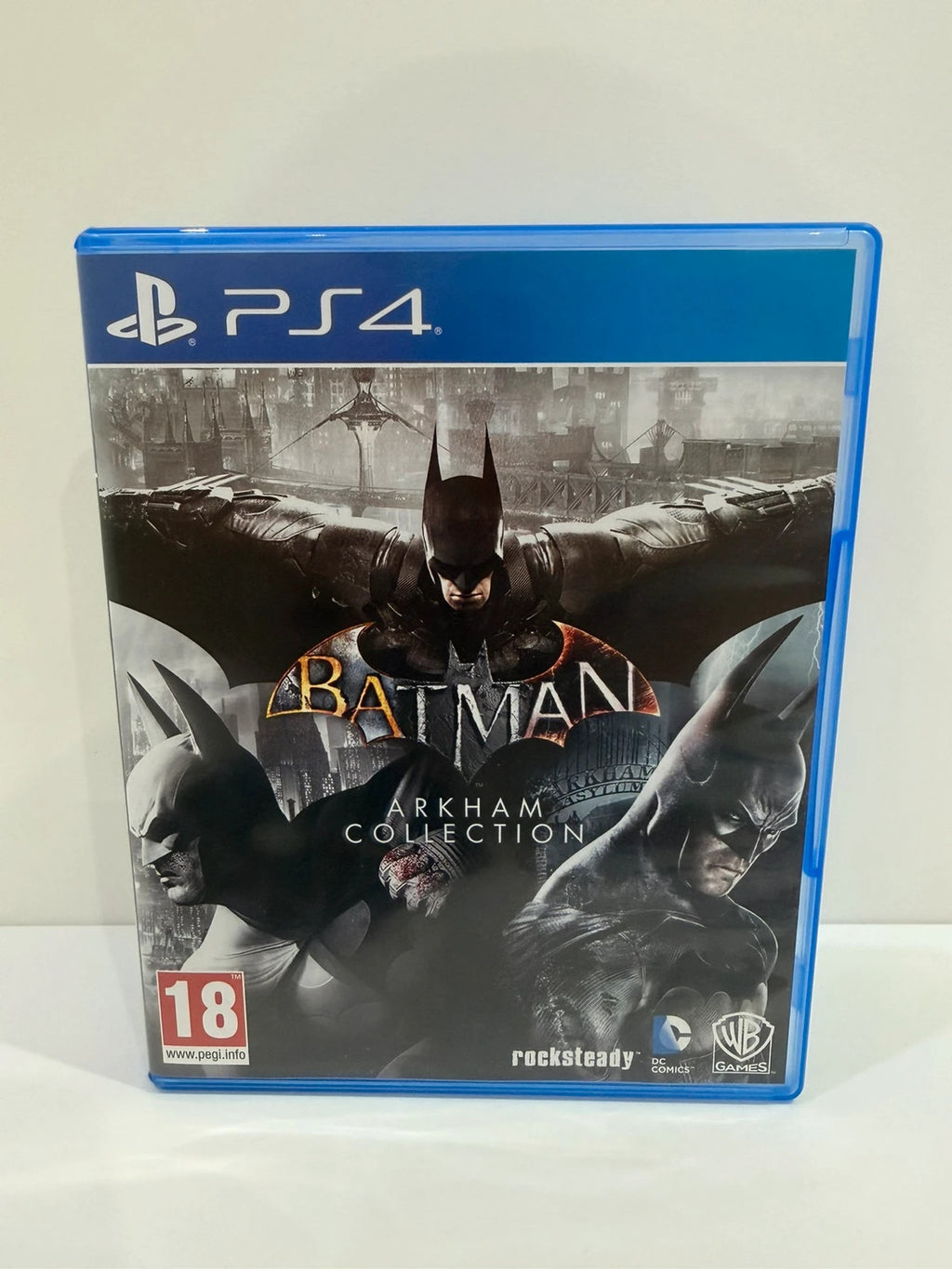 Batman Arkham Collection PS4 game case with cover art and two discs included.