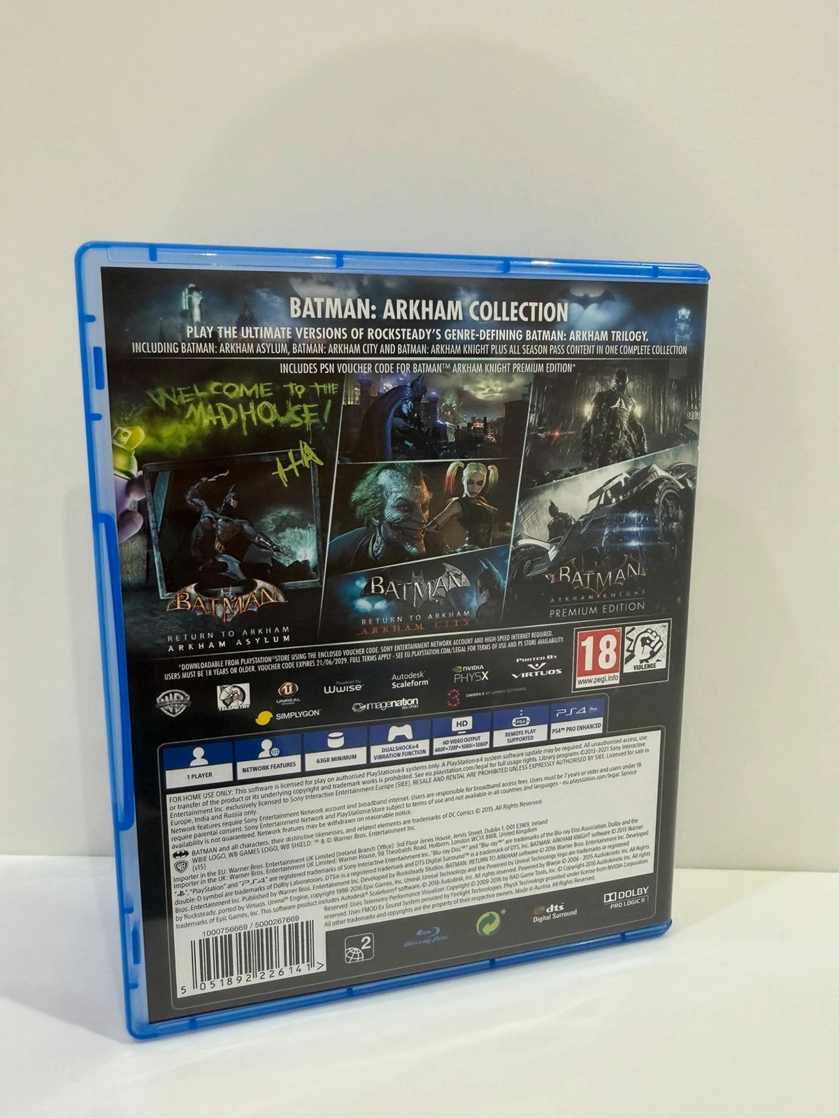Batman Arkham Collection PS4 game case with cover art and two discs included.