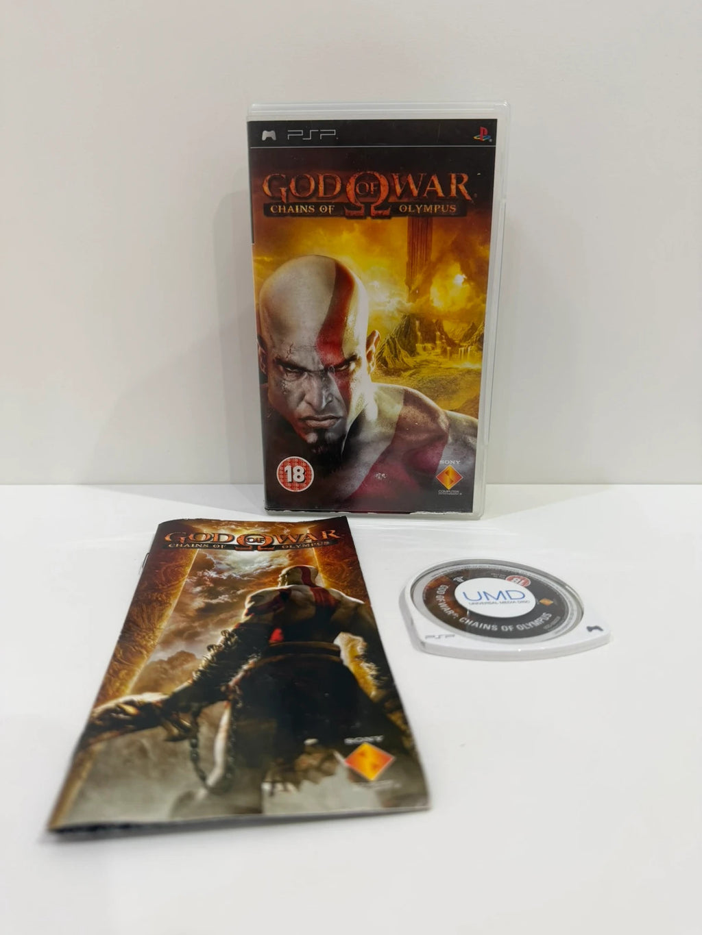 God of War Chains of Olympus PSP game complete with manual and cover art.