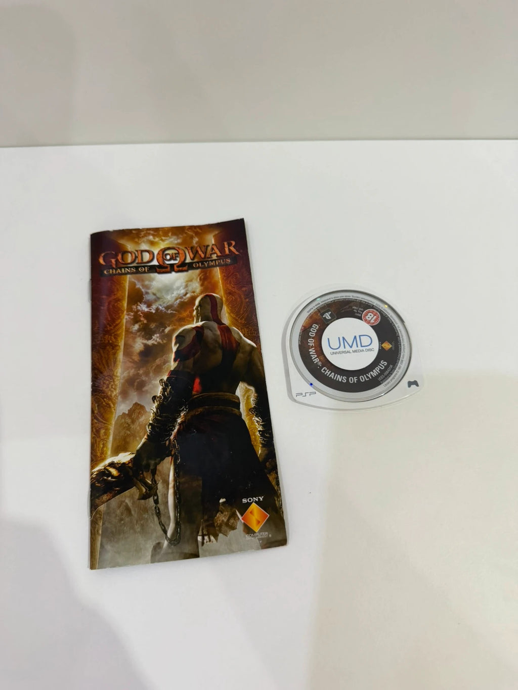God of War Chains of Olympus PSP game complete with manual and cover art.