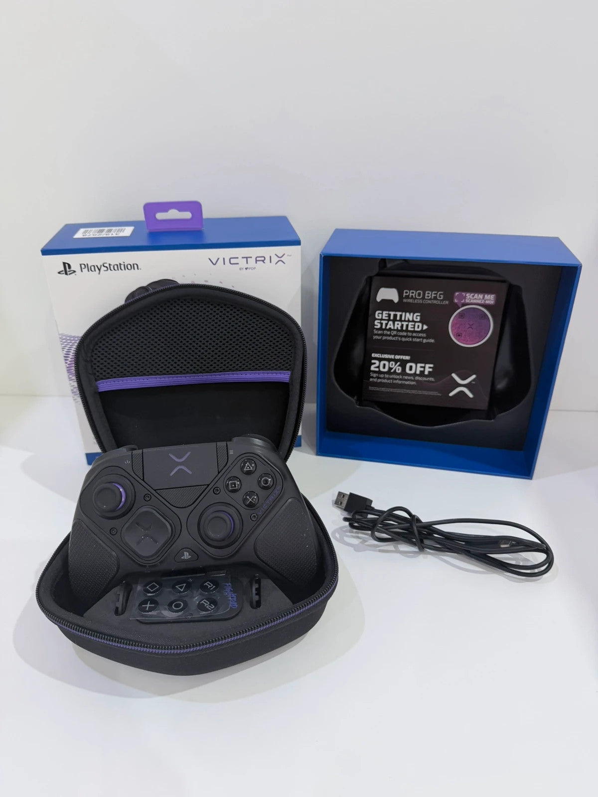 Victrix black wireless game controller with interchangeable buttons and PlayStation logo.