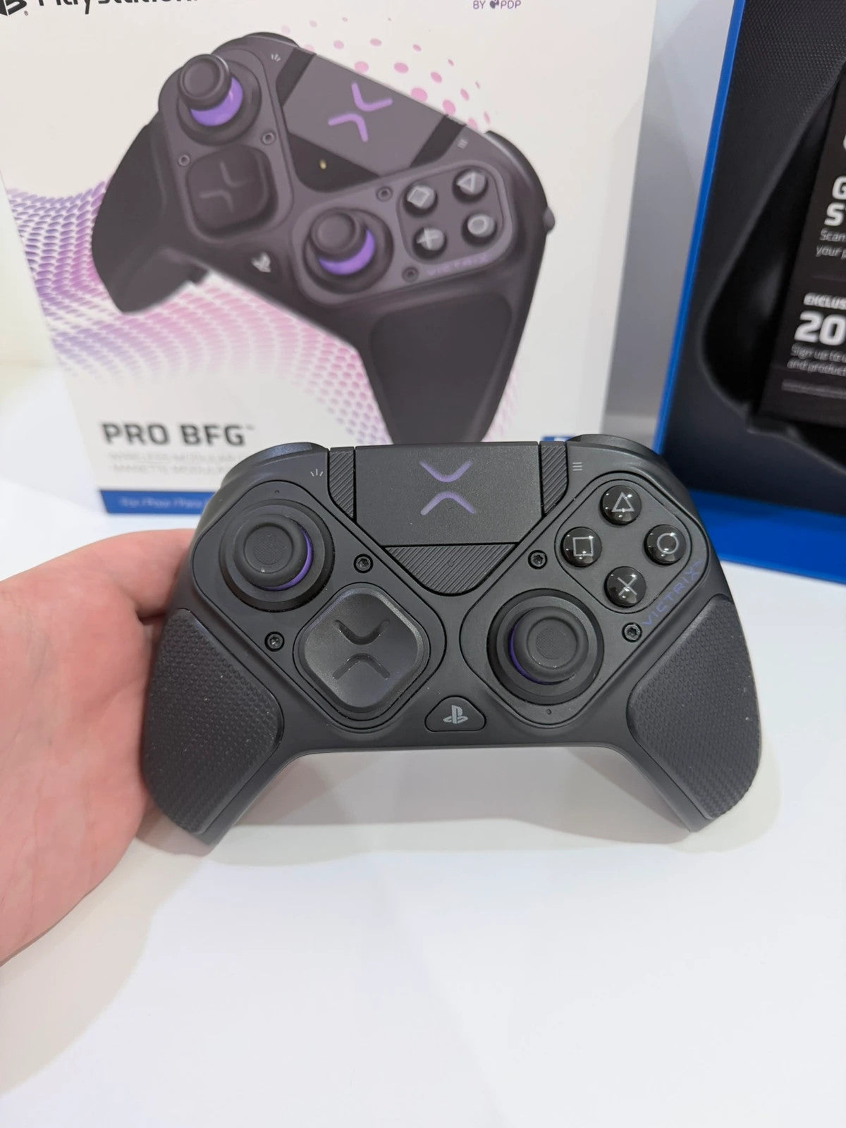 Victrix black wireless game controller with interchangeable buttons and PlayStation logo.