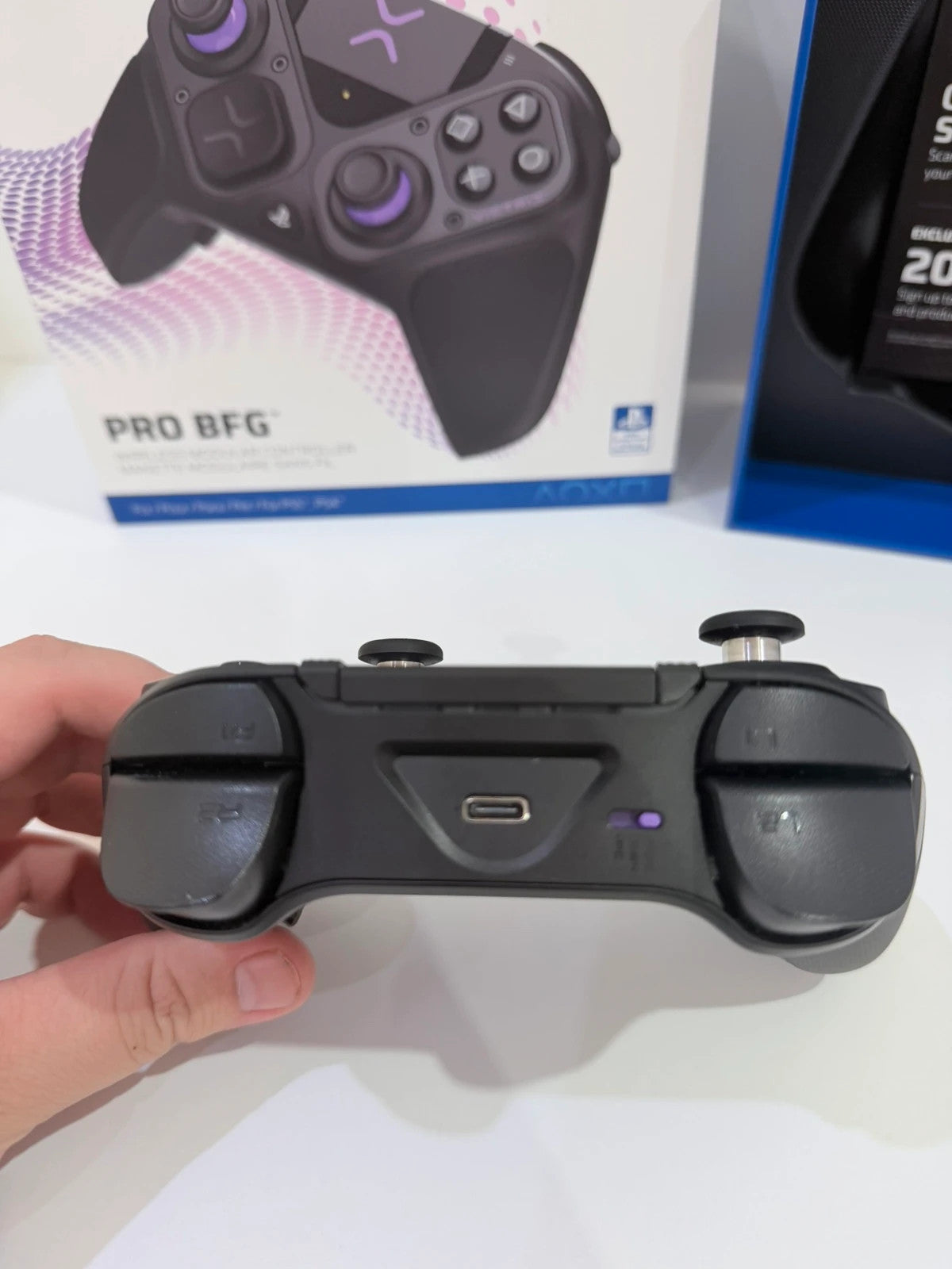 Victrix black wireless game controller with interchangeable buttons and PlayStation logo.