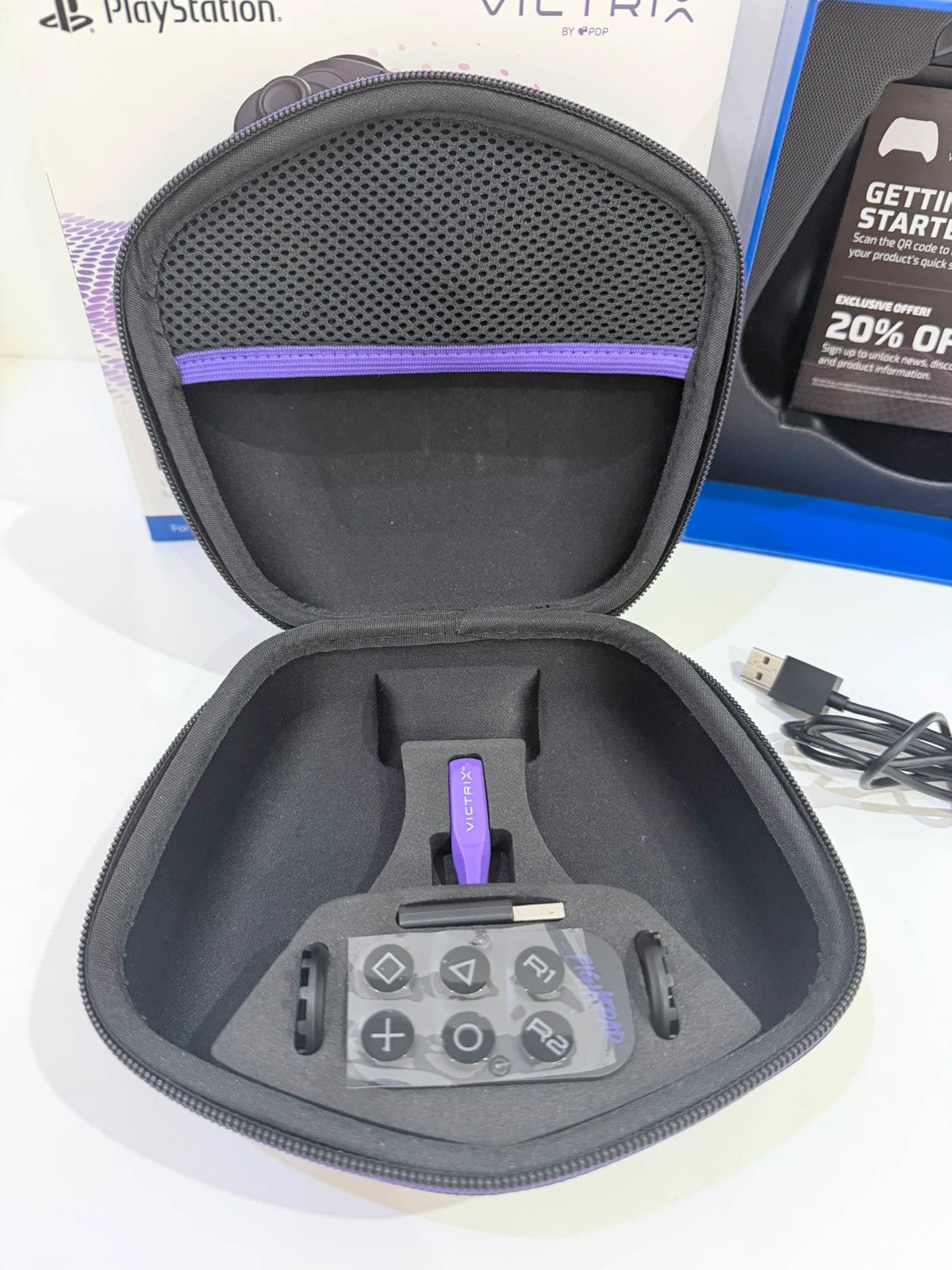Victrix black wireless game controller with interchangeable buttons and PlayStation logo.