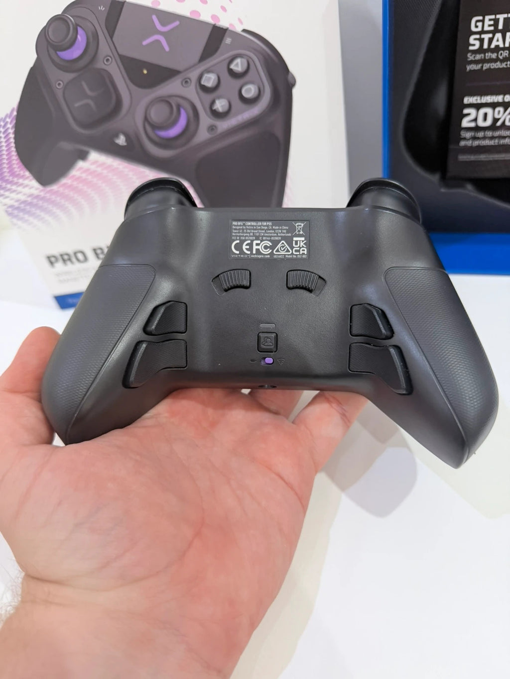 Victrix black wireless game controller with interchangeable buttons and PlayStation logo.