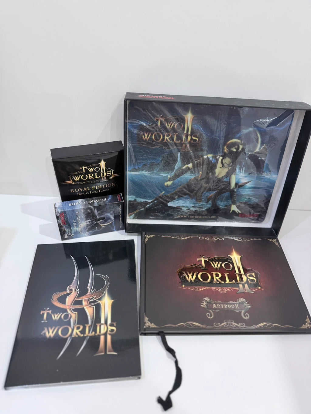 Two Worlds II Royal Edition Xbox 360 collector's statue with detailed artwork and packaging.