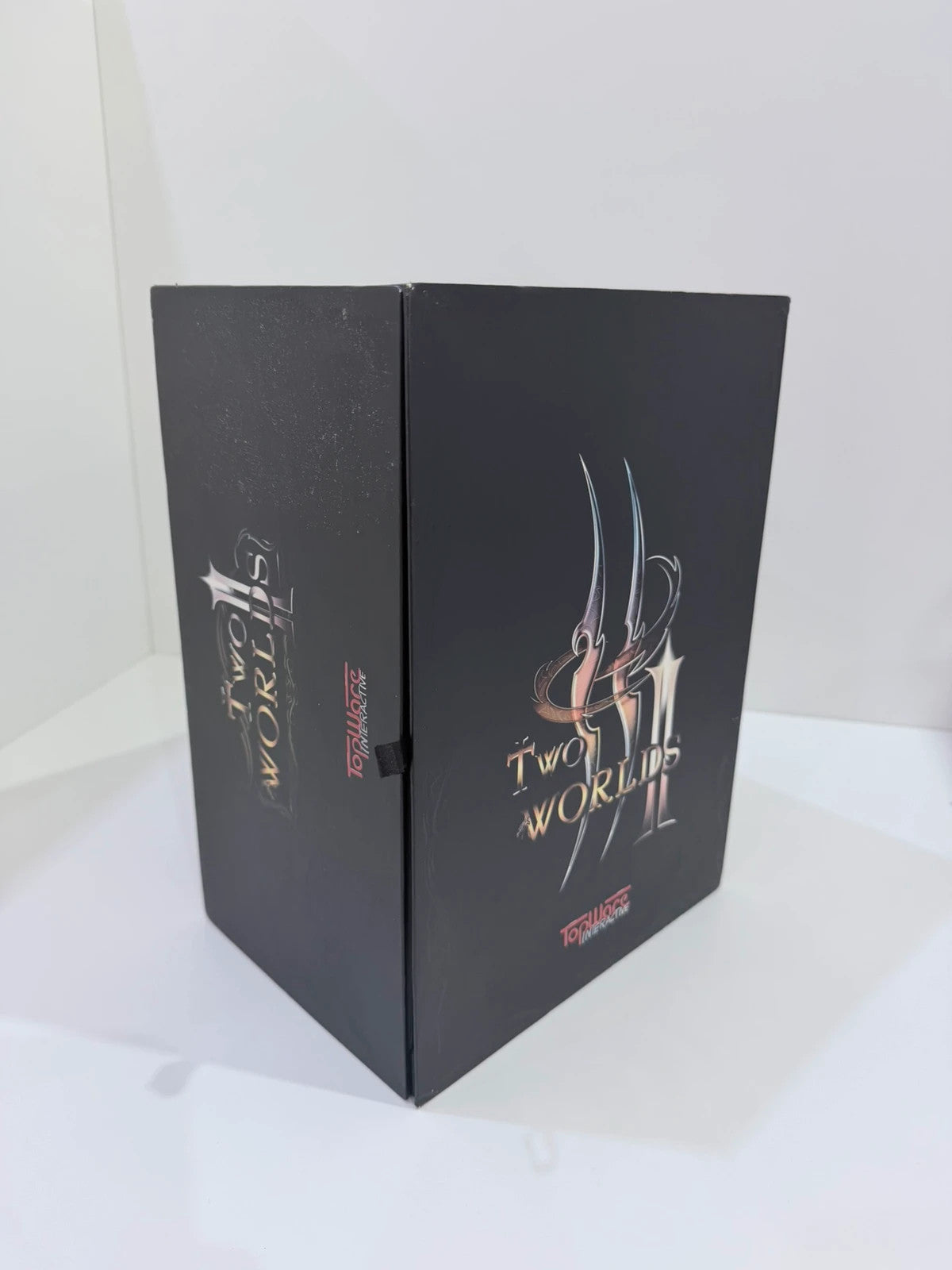 Two Worlds II Royal Edition Xbox 360 collector's statue with detailed artwork and packaging.