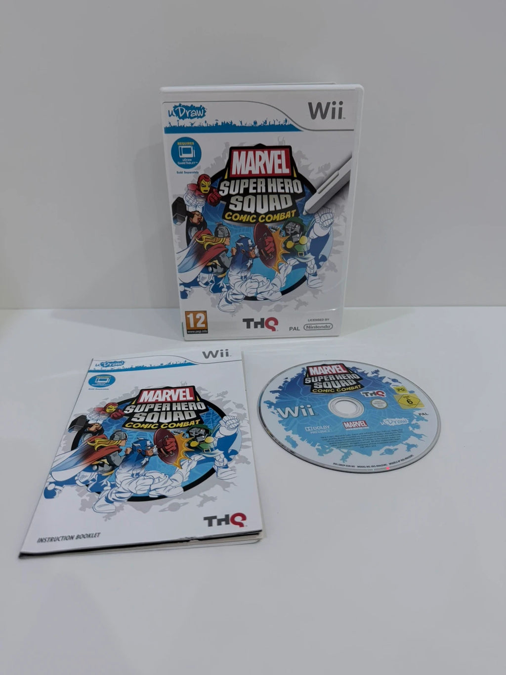 uDraw GameTablet bundle for Nintendo Wii with game cases and accessories included.