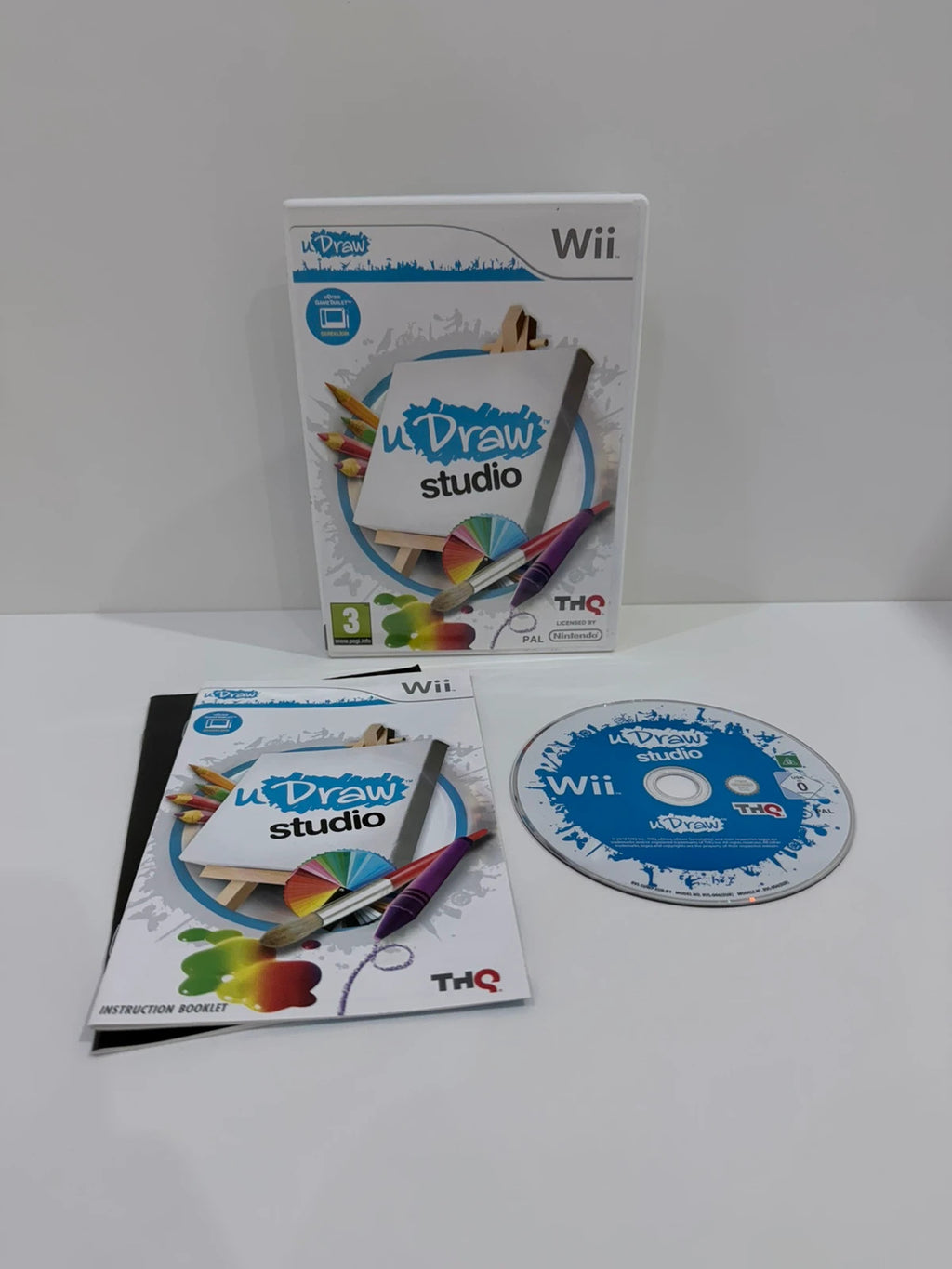 uDraw GameTablet bundle for Nintendo Wii with game cases and accessories included.