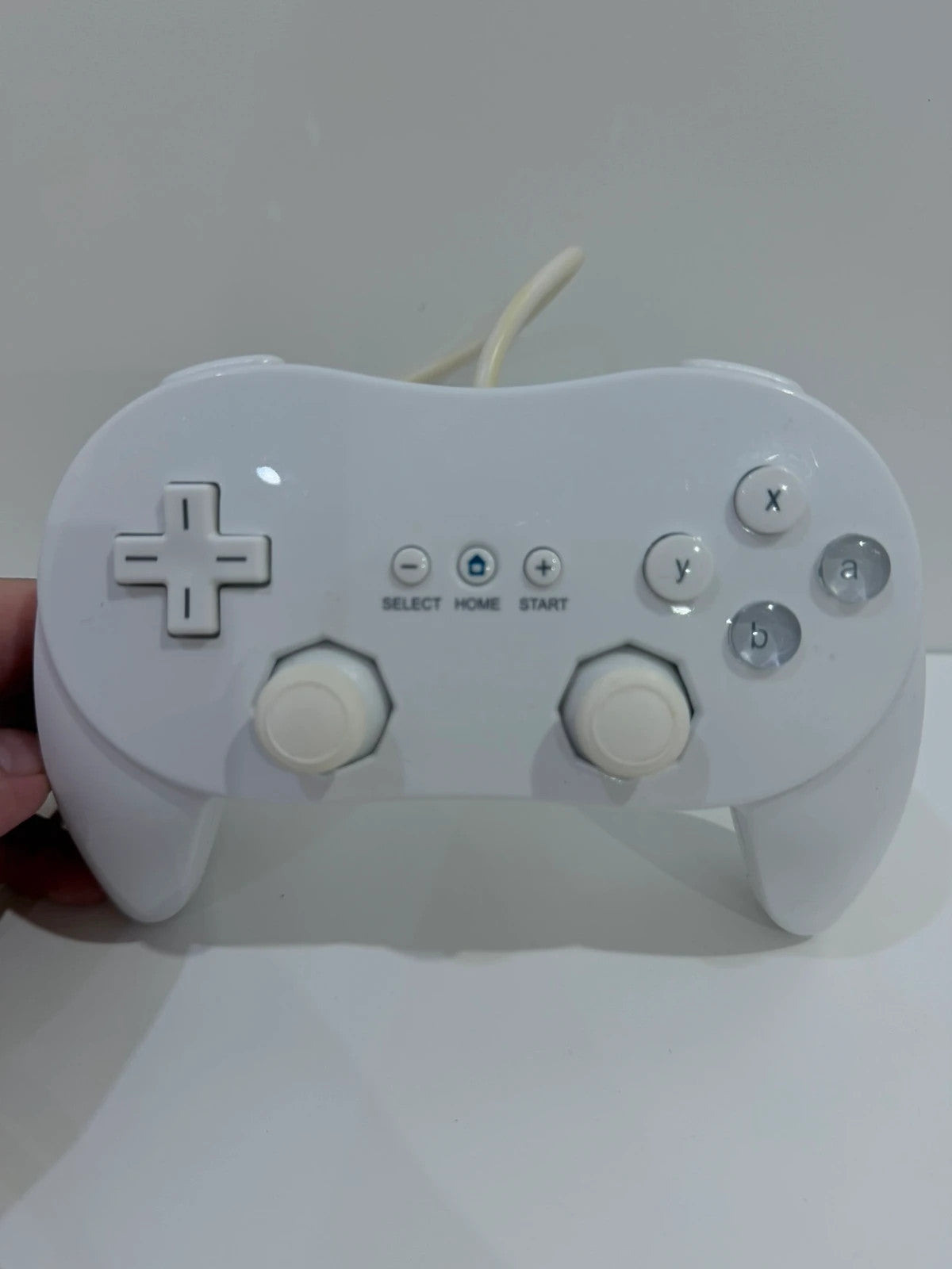 Generic white Nintendo Wii compatible Pro Controller with ergonomic design and button layout.