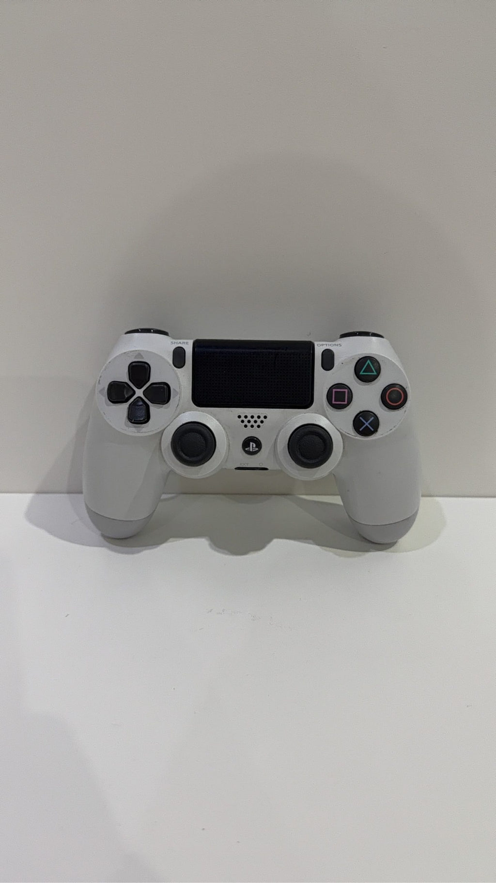 Sony PlayStation DualShock 4 Wireless Controller in white for PS4, fully tested and working.