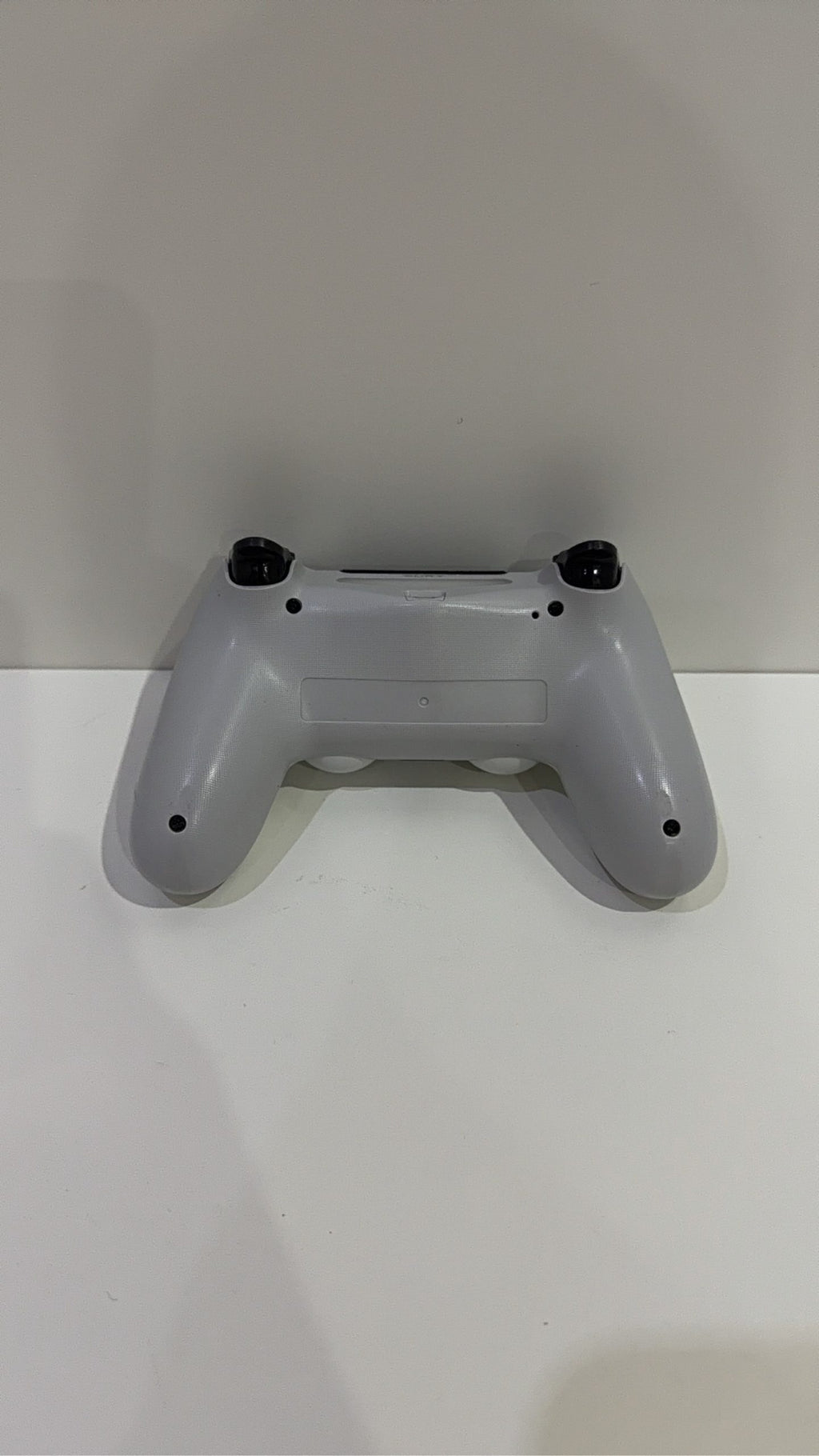 Sony PlayStation DualShock 4 Wireless Controller in white for PS4, fully tested and working.