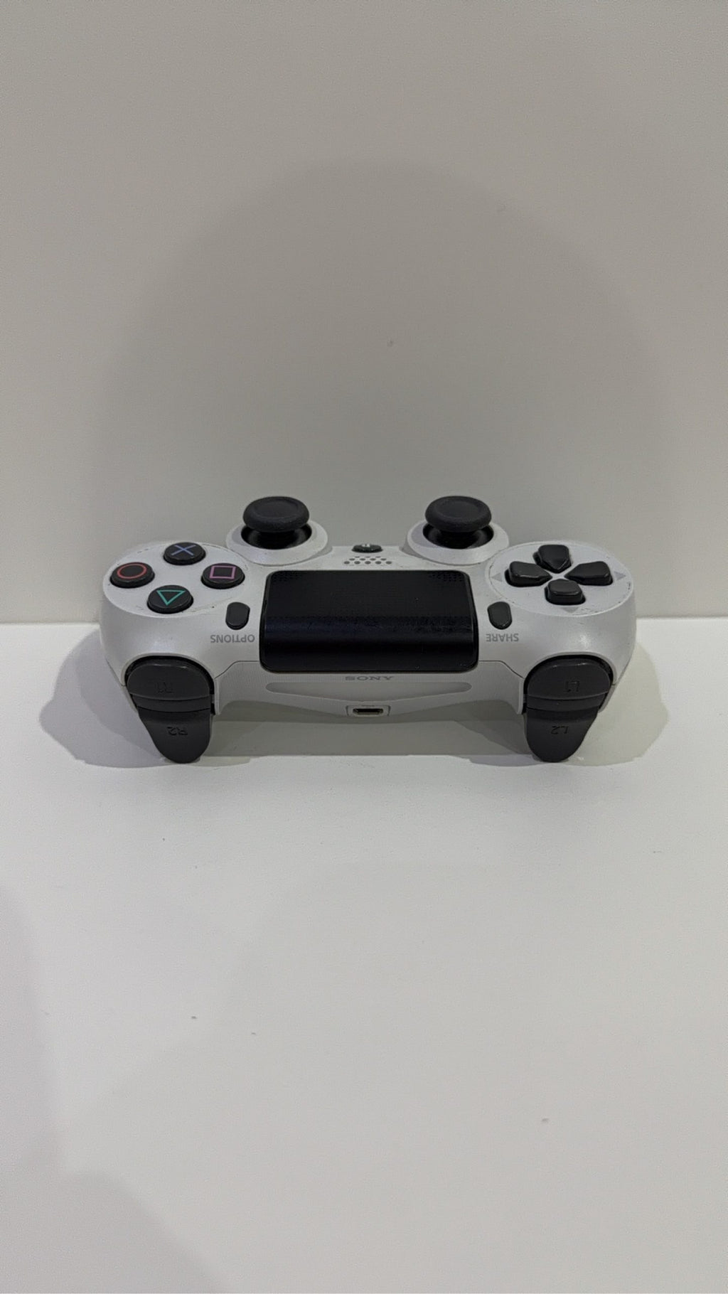 Sony PlayStation DualShock 4 Wireless Controller in white for PS4, fully tested and working.