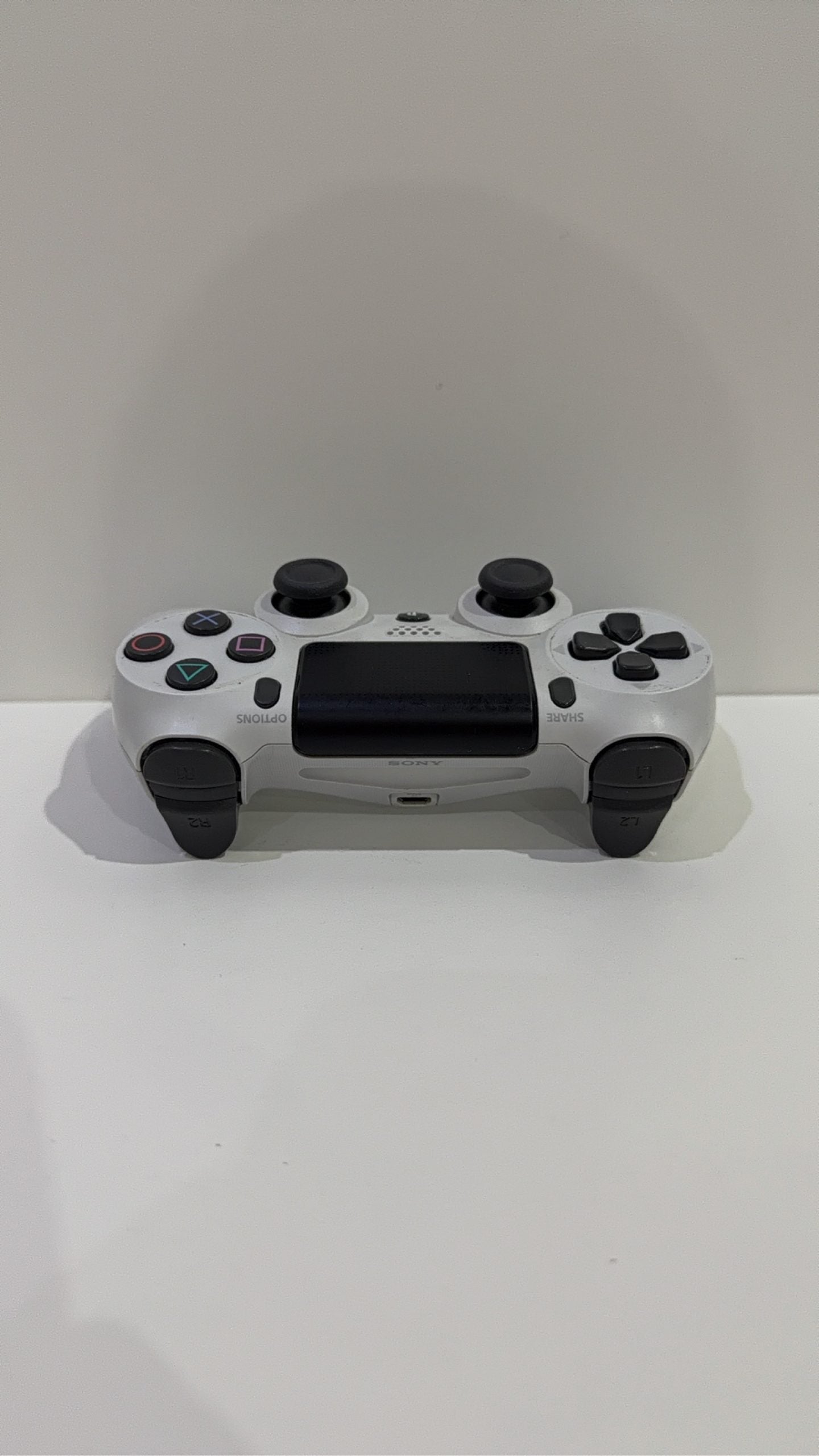 Sony PlayStation DualShock 4 Wireless Controller in white for PS4, fully tested and working.