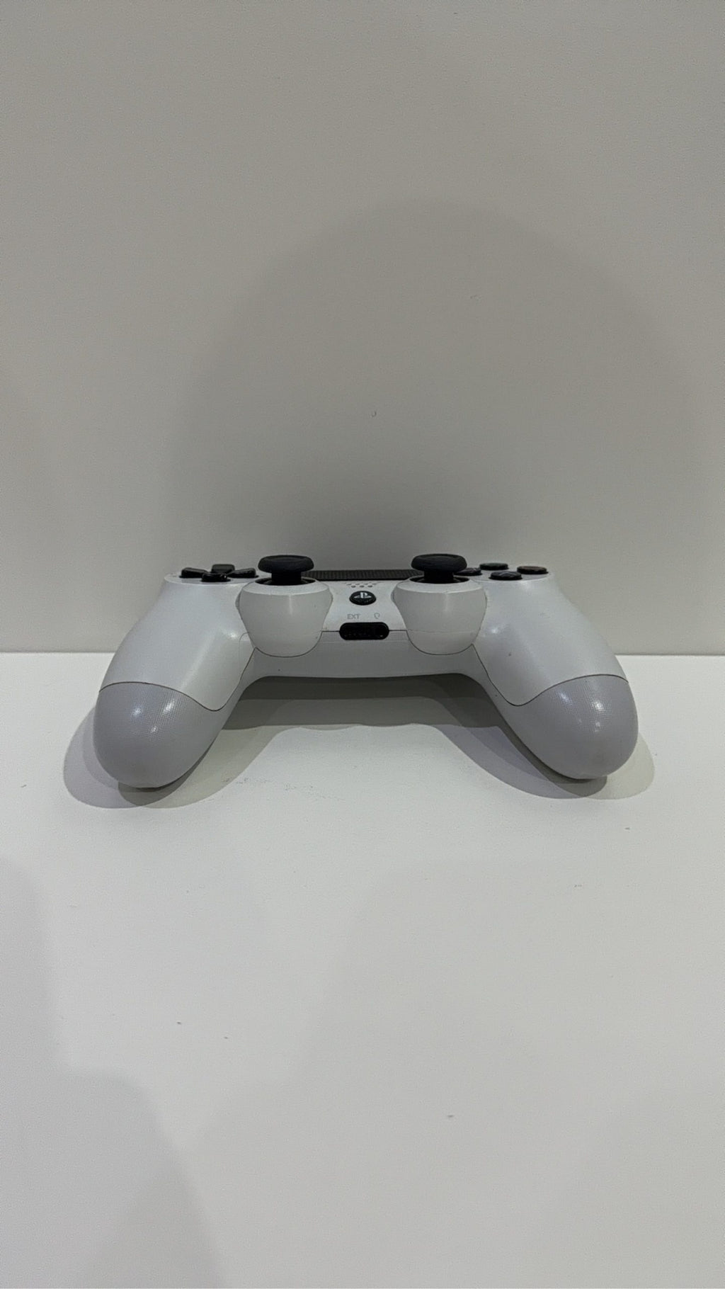 Sony PlayStation DualShock 4 Wireless Controller in white for PS4, fully tested and working.