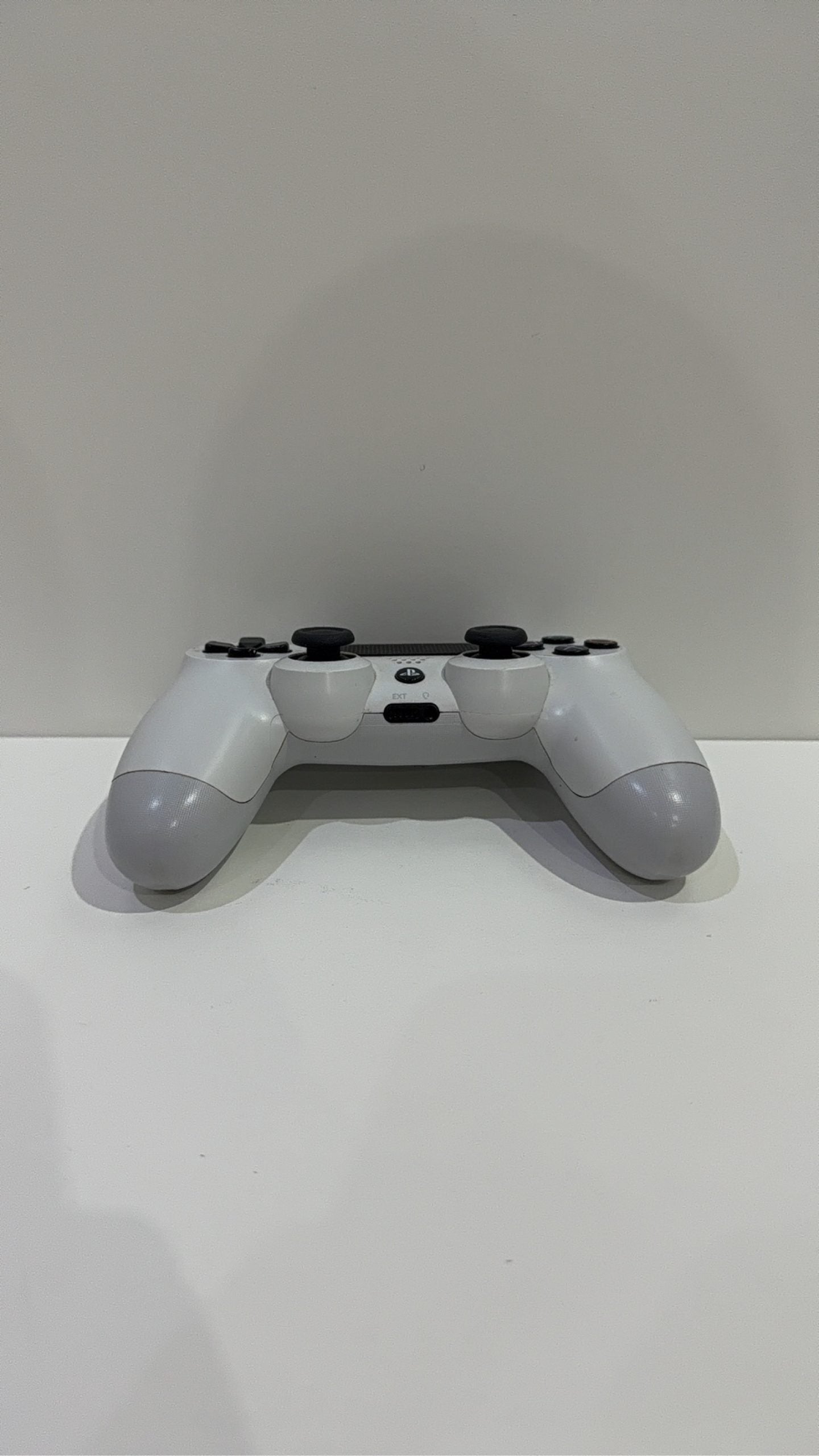 Sony PlayStation DualShock 4 Wireless Controller in white for PS4, fully tested and working.