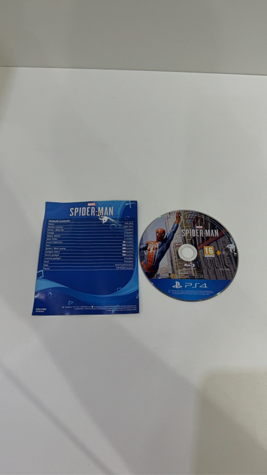 Marvel Spider-Man PS4 video game with original case, cover artwork, disc, and manual.
