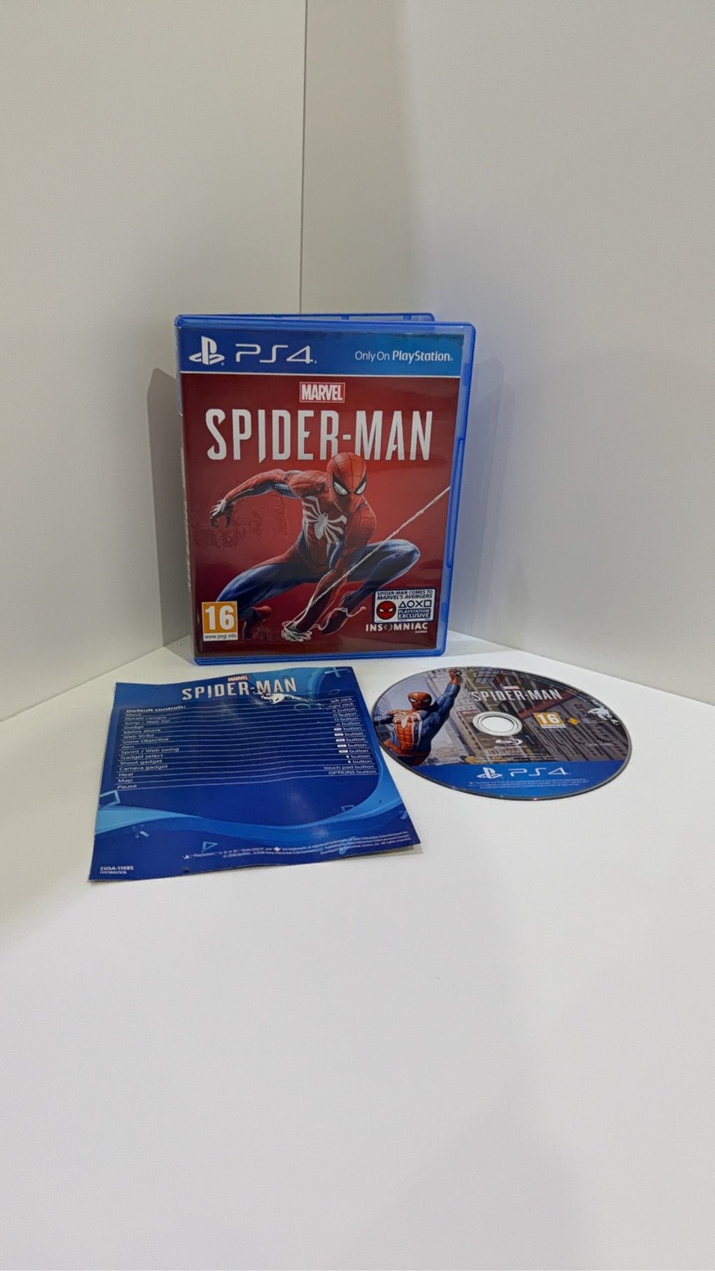 Marvel Spider-Man PS4 video game with original case, cover artwork, disc, and manual.