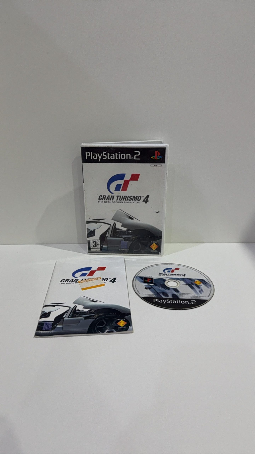 Gran Turismo 4 for Sony PlayStation 2 PS2, complete with case, manual, and game disc.