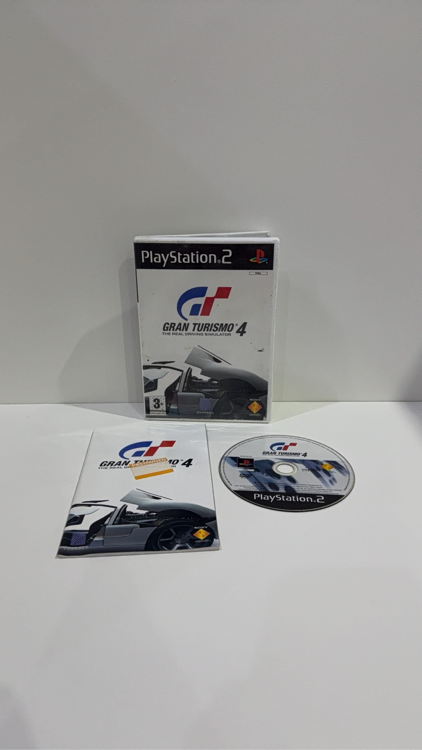 Gran Turismo 4 for Sony PlayStation 2 PS2, complete with case, manual, and game disc.