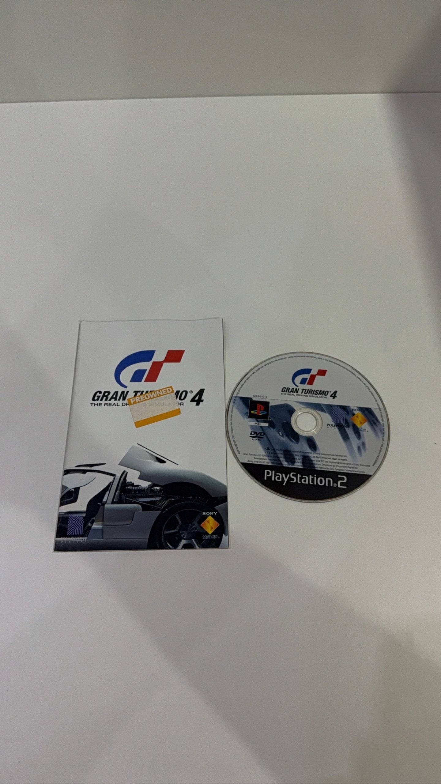 Gran Turismo 4 for Sony PlayStation 2 PS2, complete with case, manual, and game disc.
