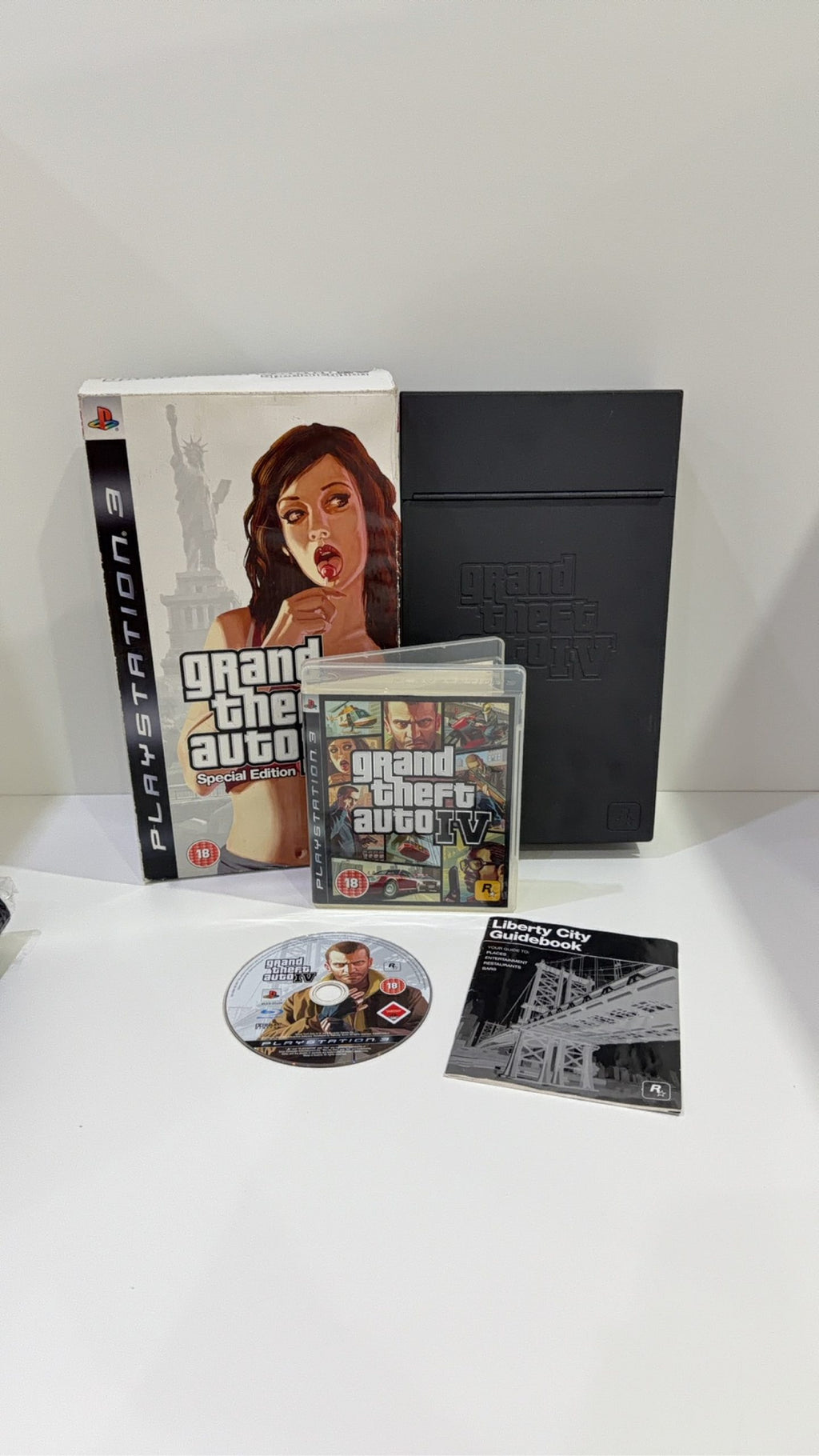 Grand Theft Auto IV Special Edition PS3 complete collector's set with game and metal lockbox.