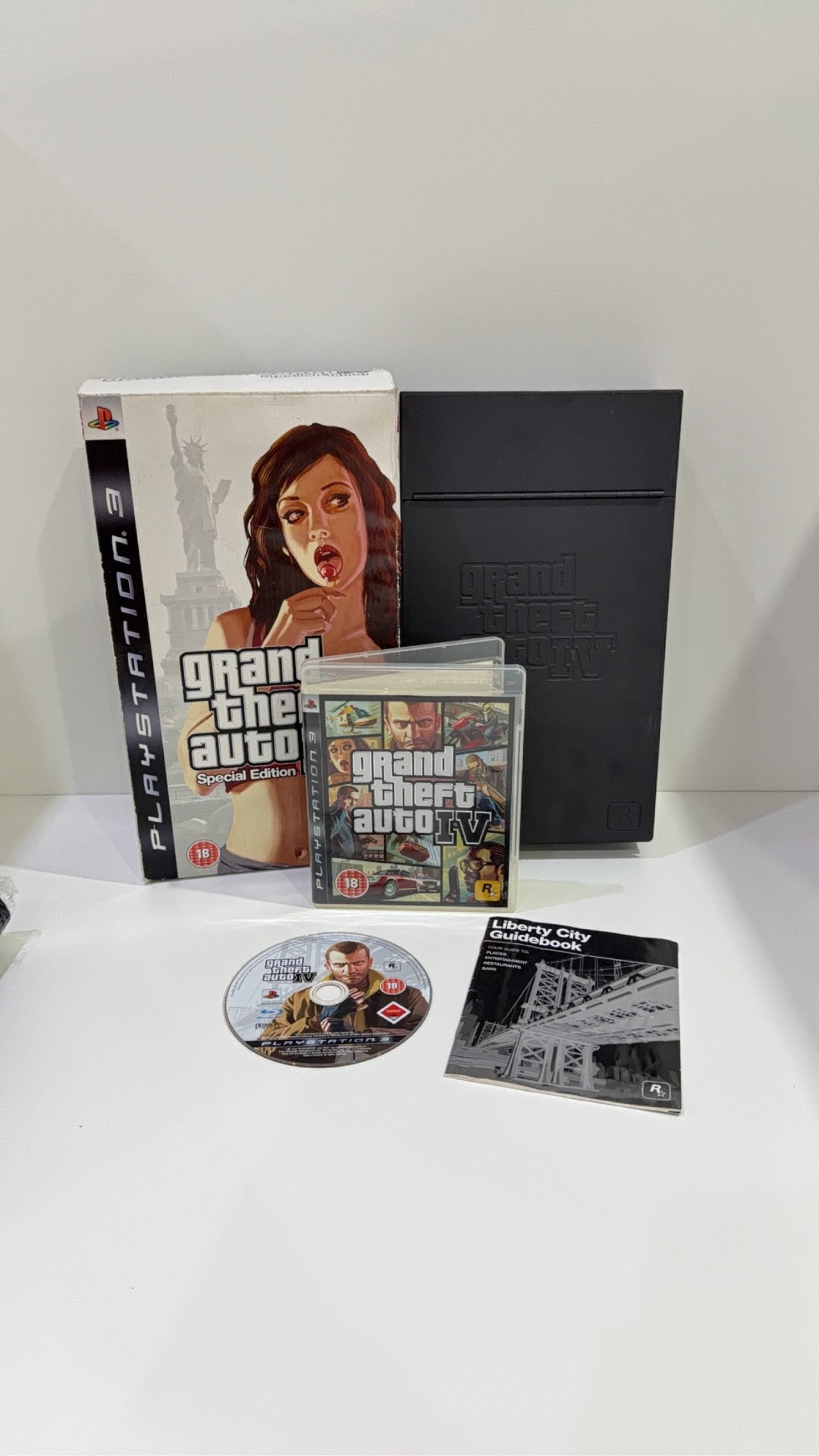 Grand Theft Auto IV Special Edition PS3 complete collector's set with game and metal lockbox.