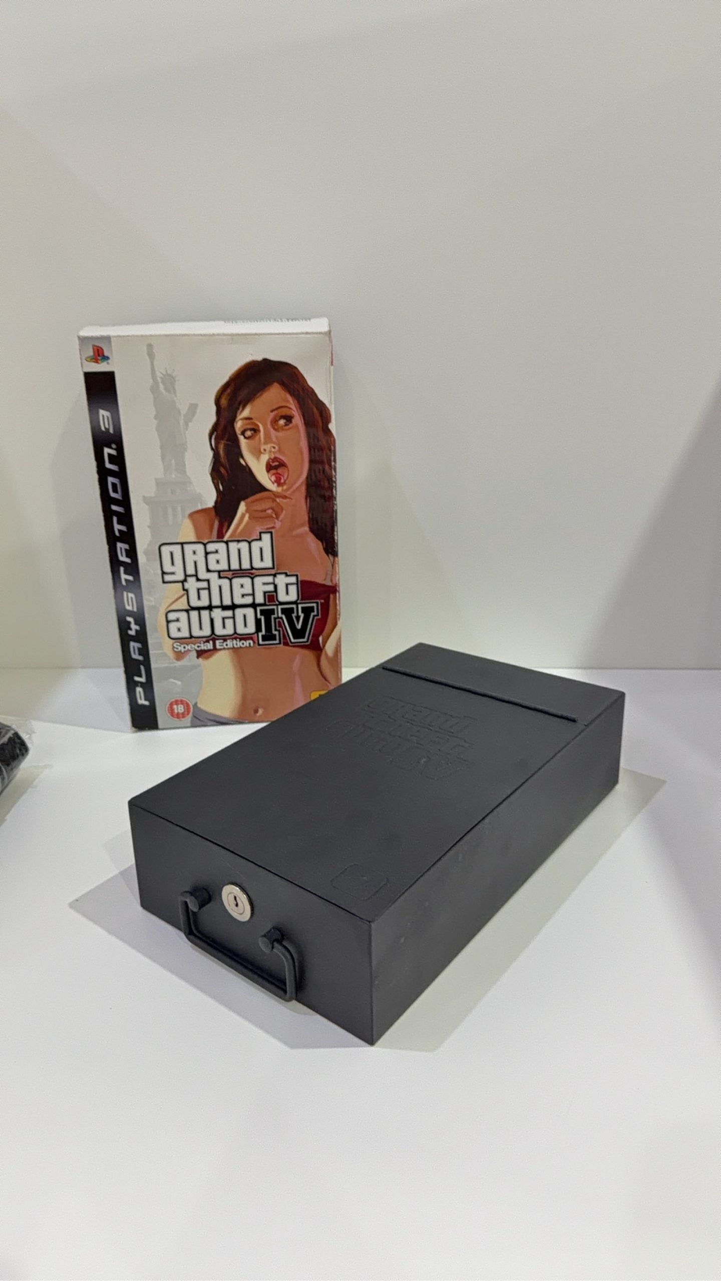 Grand Theft Auto IV Special Edition PS3 complete collector's set with game and metal lockbox.