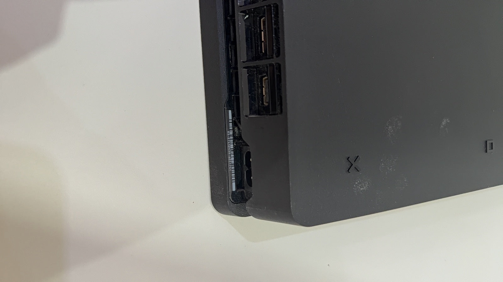 Sony PlayStation 4 Slim 500GB black console with one controller, power and HDMI cables.