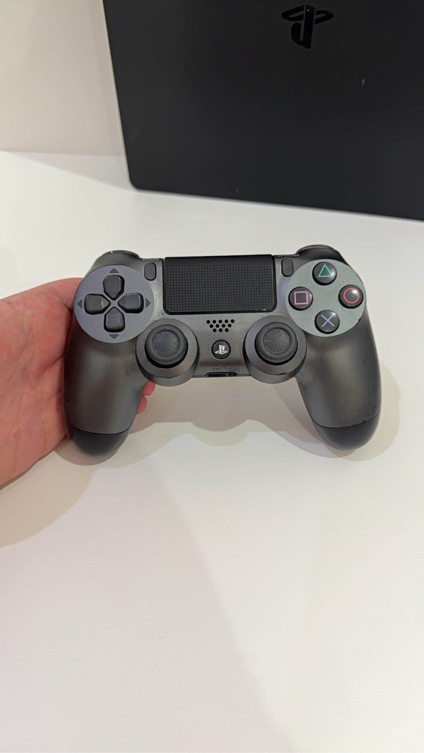 Sony PlayStation 4 Slim 500GB black console with one controller, power and HDMI cables.