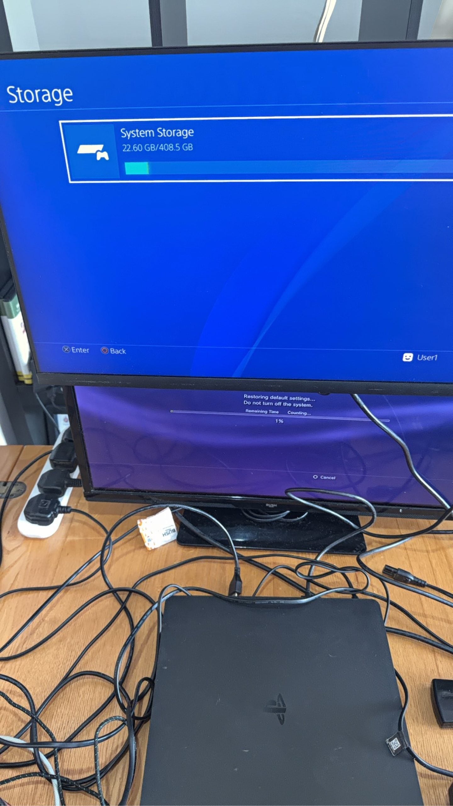 Sony PlayStation 4 Slim 500GB black console with one controller, power and HDMI cables.