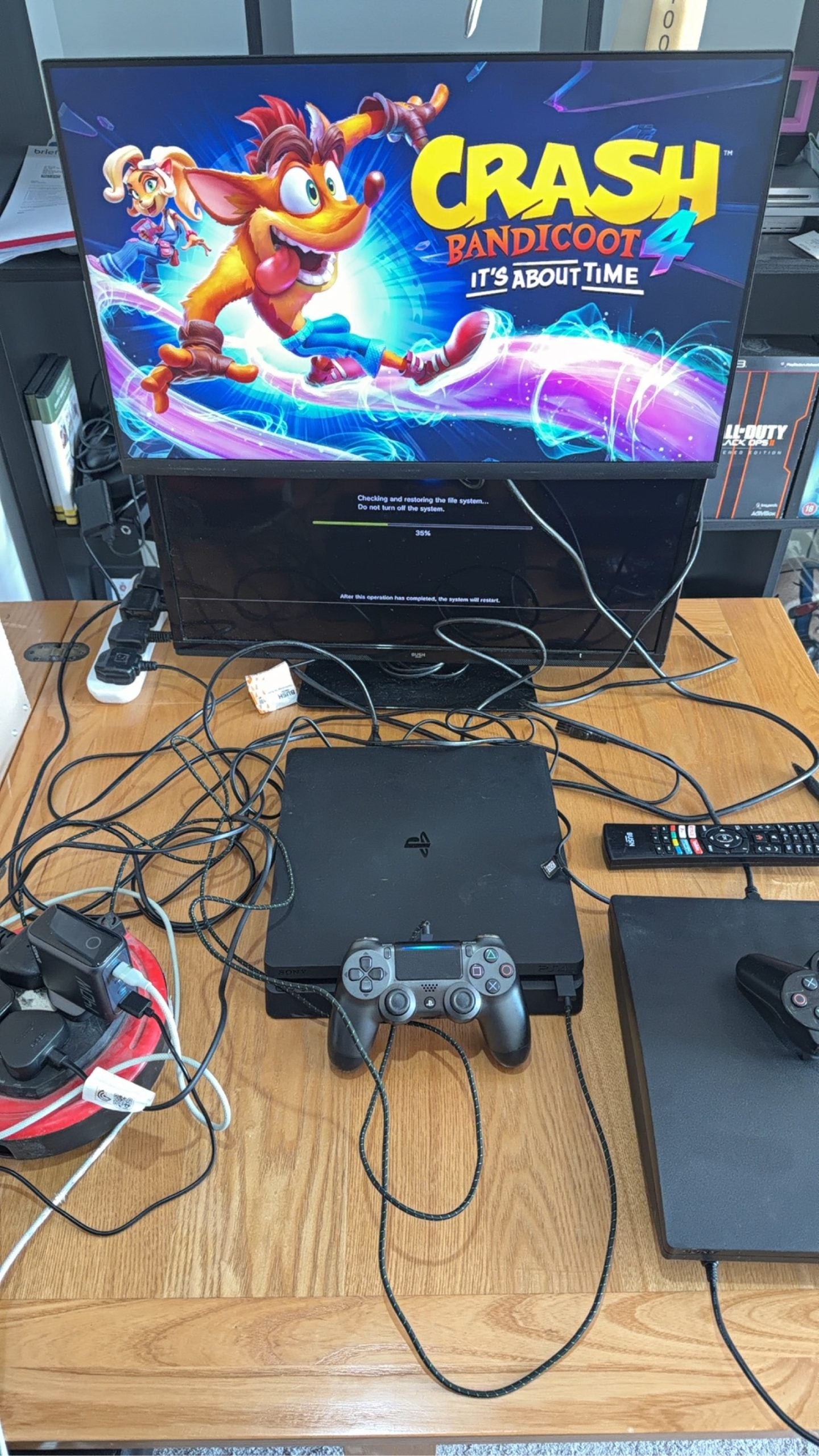 Sony PlayStation 4 Slim 500GB black console with one controller, power and HDMI cables.